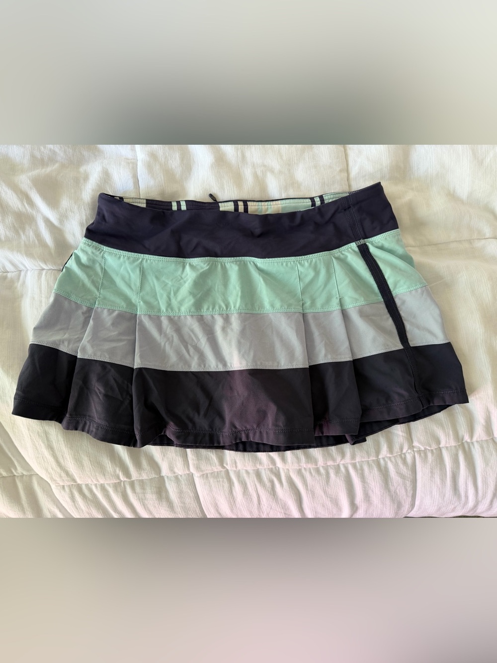 Lululemon tennis skirt,size 10,regular length - 12 in, navy w/ mint/aqua accents